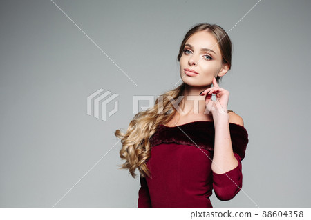 Studio portrait of attractive blond woman with 88604358