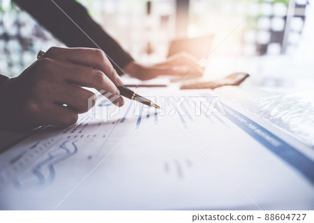 Close up Business woman hand using calculator to calculate the company's financial results and budget. Account Audit Concept. Close up Business woman hand using calculator to calculate the company's financial results and budget. Account Audit Concept. 88604727