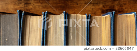 Old books on a shelf panorama. Classic literature in a second-hand bookshop 88605047