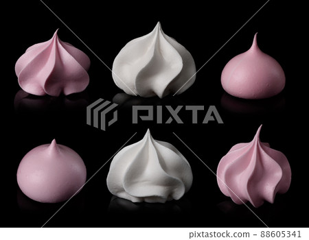 Meringue cookie set isolated on black background. Twisted sweet crispy curly white and pink meringue 88605341