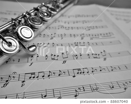 Silver flute and sheet music 7 88607040