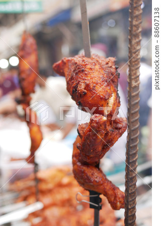 close up of slice of grill chicken display for sale  88607138