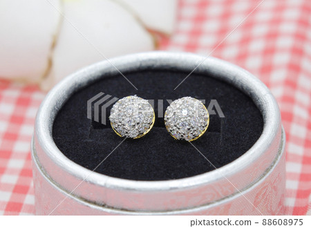 Luxury golden earrings decorated with diamond display in jewelry box 88608975