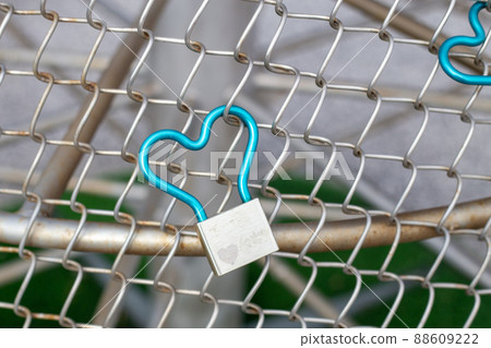 Padlock attached to the fence Padlock attached to the fence 88609222