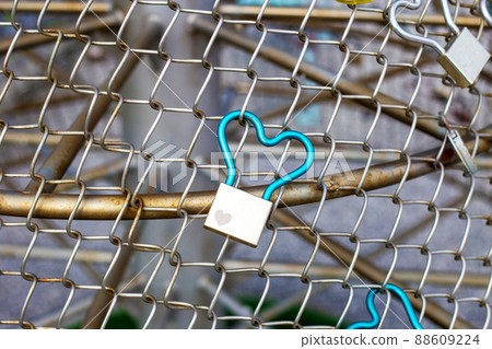 Padlock attached to the fence Padlock attached to the fence 88609224