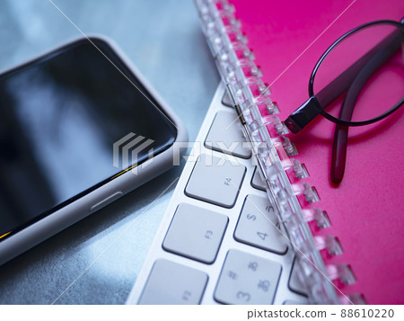 Business image of notebooks, computers, glasses, smartphones (female) Business image of notebooks, computers, glasses, smartphones (female) 88610220