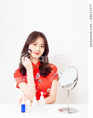 The first-ranked author, the traditional flag of the year, by the female cheongsam, Kyoko, a brush for under white background. The first-ranked author, the traditional flag of the year, by the female cheongsam, Kyoko, a brush for under white background. 88612577