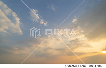 Sunset sky. Abstract nature background. Dramatic blue with orange colorful clouds in twilight time. 88612866