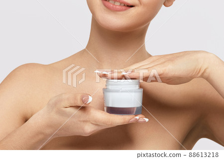 Hand With Cream. Closeup Of Woman Hands With Body Skin Lotion. Girl holding cosmetic cream 88613218