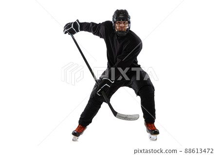 On the run. Male hockey player with the stick on ice court and white background. On the run. Male hockey player with the stick on ice court and white background. 88613472