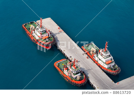 Tug boats are moored in port. Aerial view. Jedda port 88613720