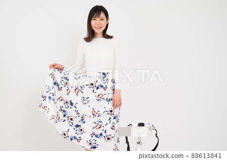 Woman in fashion pose in front of camera Woman in fashion pose in front of camera 88613841