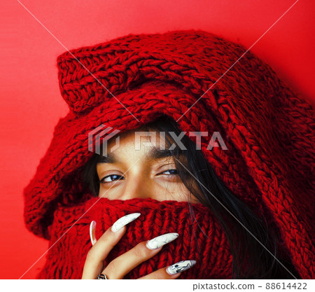 young pretty indian girl in red sweater posing emotional, fashion hipster teenage, lifestyle people concept 88614422