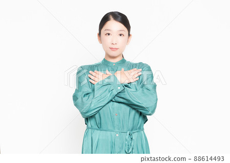 Housewife putting her hand on her chest in front of a white background Housewife putting her hand on her chest in front of a white background 88614493
