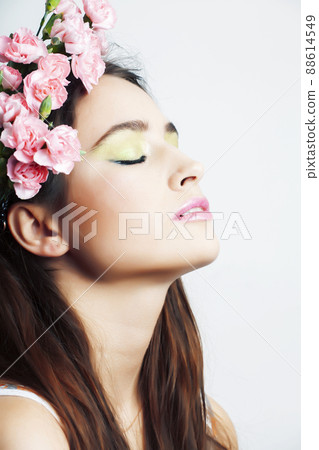 Beauty young real woman with pink flowers and make up closeup, spa salon, womans day concept Beauty young real woman with pink flowers and make up closeup, spa salon, womans day concept 88614549