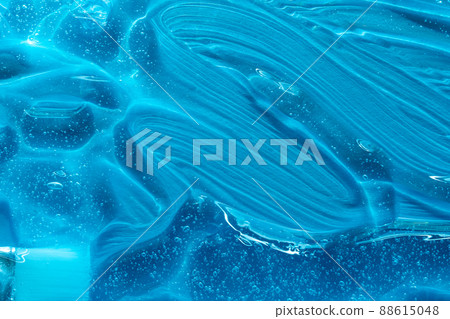Brush and serum texture, clear gel bubbles on blue background. Skincare lotion face product swatch. Hyaluronic acid for skin care with collagen and retinol. Beauty toner. . 88615048