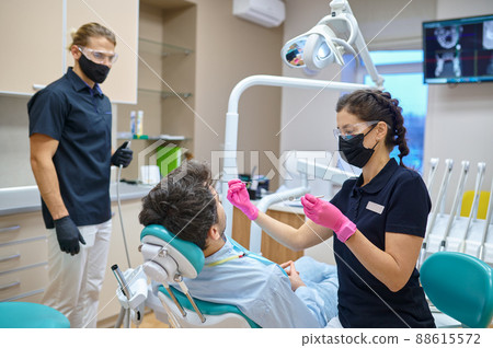 Patient having teeth examination at dental consultation Patient having teeth examination at dental consultation 88615572