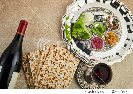 Passover Seder plate with traditional food ontravertine stone background 88615684