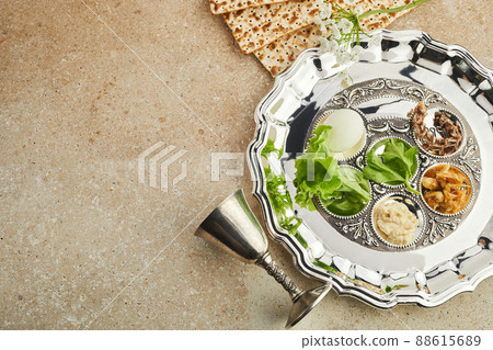 Passover Seder plate with traditional food ontravertine stone background Passover Seder plate with traditional food ontravertine stone background 88615689