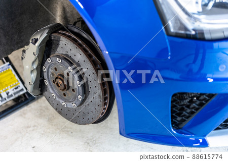 Vehicle disc brake for repair, process of replacing new tires, car brake repair in the garage, transport concept Vehicle disc brake for repair, process of replacing new tires, car brake repair in the garage, transport concept 88615774