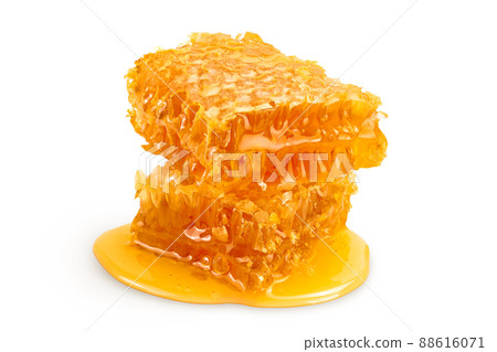 Honeycombs and honey puddle isolated on white background with clipping path and full depth of field 88616071
