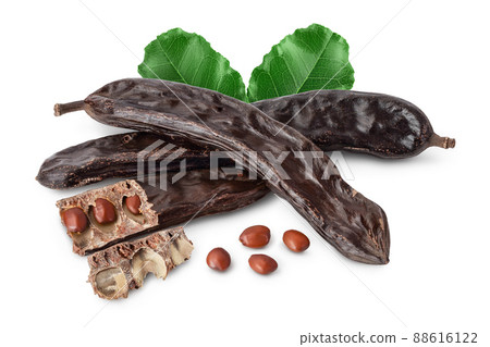Ripe carob pods and bean isolated on white background with clipping path and full depth of field 88616122