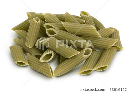 Green pea penne pasta isolated on white background with clipping path. Organic food speciality. Gluten free 88616132