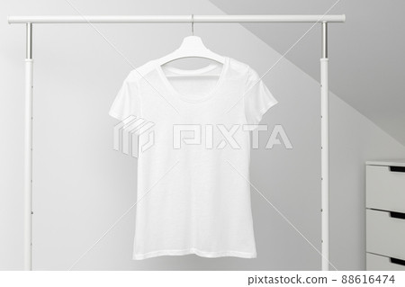 T-shirt hanging on Clothing rack. Round neck white color. Template, mock up T-shirt hanging on Clothing rack. Round neck white color. Template, mock up 88616474
