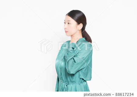 A housewife who has a sore throat and puts her hand on it A housewife who has a sore throat and puts her hand on it 88617234