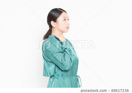 A housewife who has a sore throat and puts her hand on it A housewife who has a sore throat and puts her hand on it 88617236