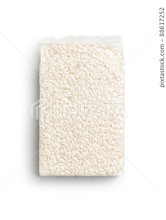 Packed Carnaroli risotto rice isolated on white background. Packed Carnaroli risotto rice isolated on white background. 88617252