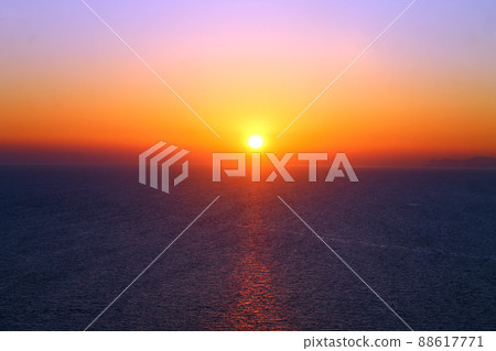 A rainbow sunset over the colored ocean A rainbow sunset over the colored ocean 88617771