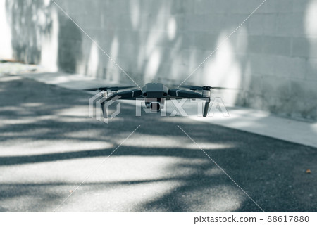 drone copter flying with digital camera in outdoor drone copter flying with digital camera in outdoor 88617880