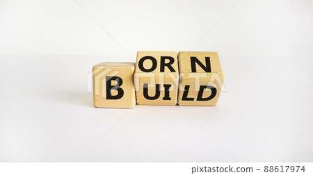 Born or build symbol. Turned wooden cubes and changed the word 'born' to 'build'. Beautiful white background. Born or build and business concept. Copy space. 88617974