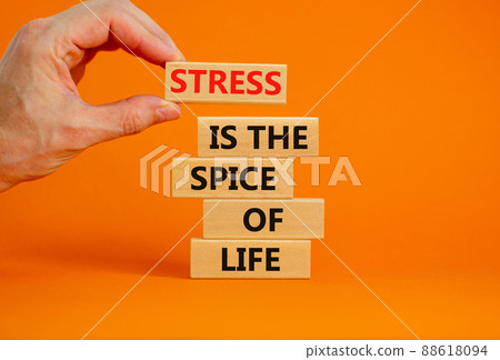 Stress spice of life symbol. Concept words Stress is the spice of life on wooden blocks. Businessman hand. Beautiful orange background. Business motivational stress spice of life concept. Copy space. 88618094