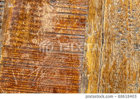 Brown wood texture of old wooden table with many scratches and marks of use 88618403