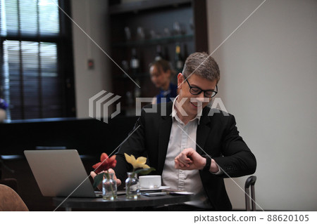 businessman checking a travelling passport. passengers in lounge International airports. exclusive room businessman checking a travelling passport. passengers in lounge International airports. exclusive room 88620105