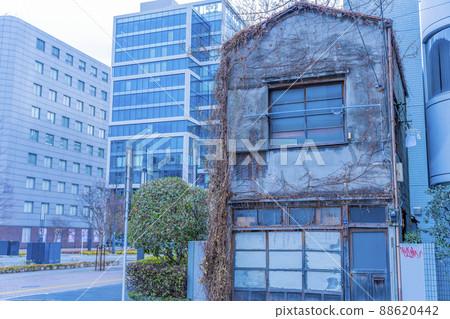 House left behind in urban redevelopment House left behind in urban redevelopment 88620442
