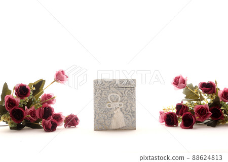 An urn and flower arrangement for memorial service placed on the windowsill 5 An urn and flower arrangement for memorial service placed on the windowsill 5 88624813