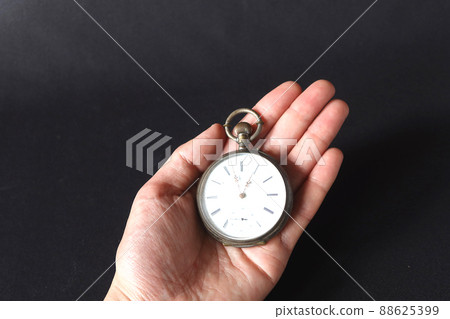 Pocket watch in the palm of a man 1 88625399