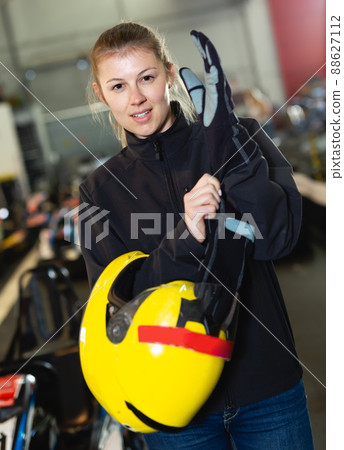 Portrait of fine woman holding helmet 88627112