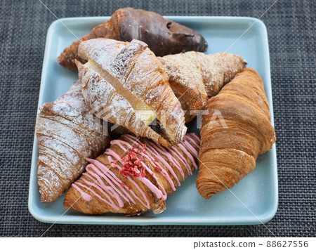 Variety of croissants and macarons Variety of croissants and macarons 88627556