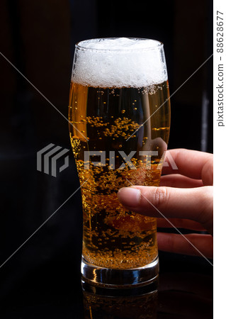 Beer poured into a glass Beer poured into a glass 88628677