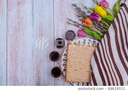 Jewish traditional Passover holiday celebration of kosher wine and matzah bread on Pesach 88629311