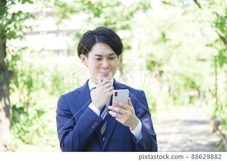 Businessman smartphone outdoors Businessman smartphone outdoors 88629882