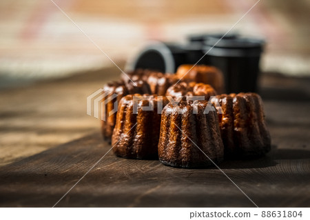 Canelé. Traditional French sweet dessert. Canelé. Traditional French sweet dessert. 88631804
