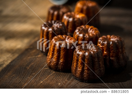 Canelé. Traditional French sweet dessert. Canelé. Traditional French sweet dessert. 88631805
