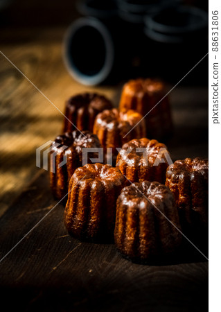 Canelé. Traditional French sweet dessert. Canelé. Traditional French sweet dessert. 88631806