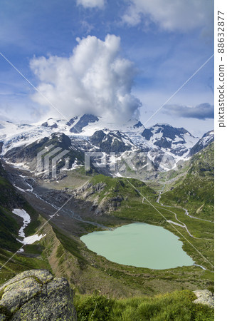 Typical alpine landscape of Swiss Alps with Steinsee, Urner Alps, Canton of Bern, Switzerland Typical alpine landscape of Swiss Alps with Steinsee, Urner Alps, Canton of Bern, Switzerland 88632877