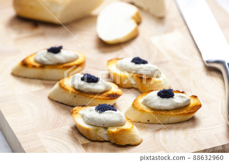 anchovy spread on toasted baguette slices anchovy spread on toasted baguette slices 88632960